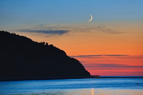 Canada-Quebec-Mont-Louis Crescent moon sunrise on Gulf of St Lawrence